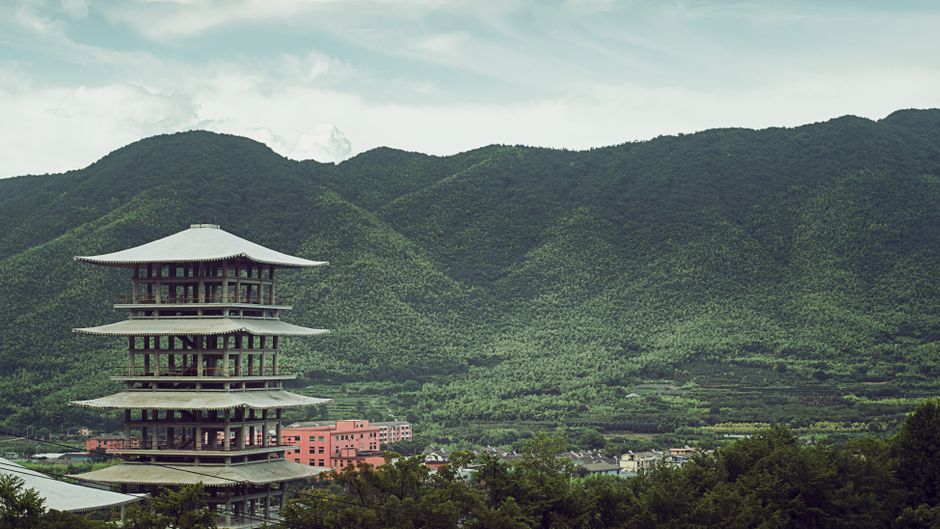 Red pagoda of Koyasan Garan rising above the green valley