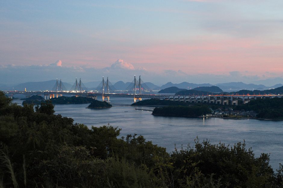 Sunset over the Seto Inland Sea seen from the cycling route with islands in silhouette